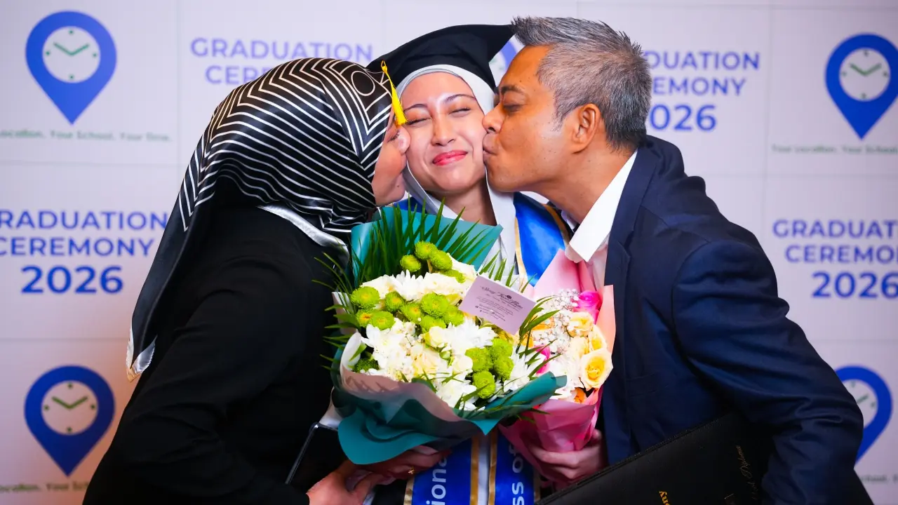 A graduate celebrated by her family with flowers at the graduation ceremony