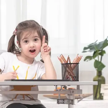 A young girl learning at home